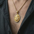 Load image into Gallery viewer, Gold plated Jesus Christ prayer pendant necklace worn on the chest, premium lifestyle jewelry photo with the Jesus prayer medal centered on a spiga chain.
