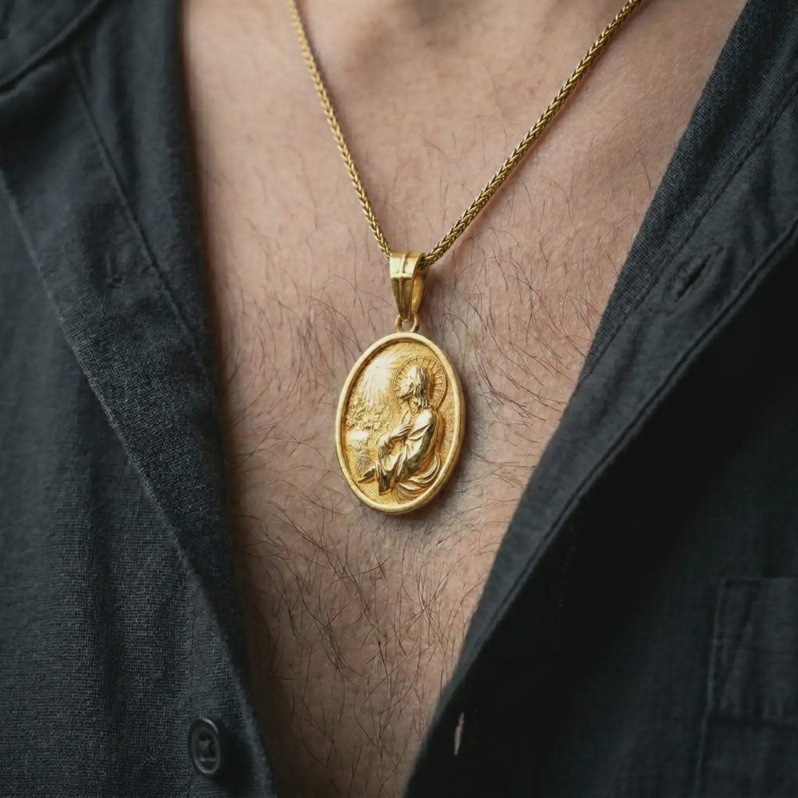 Gold plated Jesus Christ prayer pendant necklace worn on the chest, premium lifestyle jewelry photo with the Jesus prayer medal centered on a spiga chain.