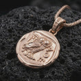 Load image into Gallery viewer, Rose gold plated Athena owl coin pendant necklace presented on textured volcanic stone, showcasing the owl emblem, engraved ancient symbols, and weathered coin-inspired surface in a macro studio shot.
