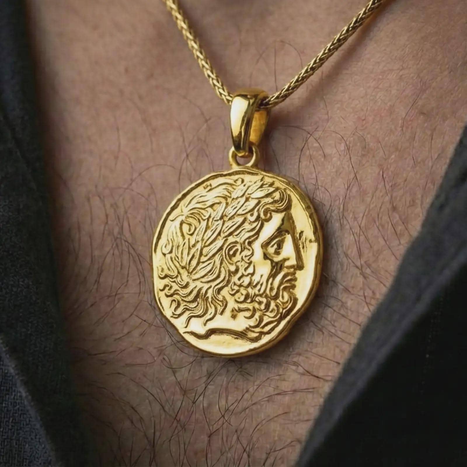Gold plated ancient Greek coin pendant necklace worn on the neck, captured in a premium lifestyle composition that highlights the mythological coin portrait as a distinctive heritage jewelry accent.