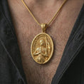 Load image into Gallery viewer, Gold plated Saint Joan of Arc pendant necklace worn on the chest, premium lifestyle jewelry photo with the Catholic saint medal centered on a spiga chain.
