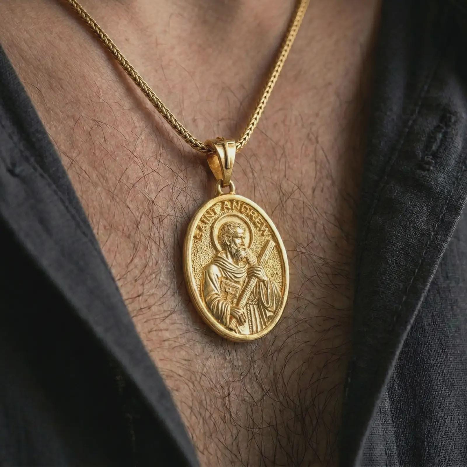 Gold plated Saint Andrew pendant necklace worn on the chest, premium lifestyle jewelry photo with the Saint Andrew medal centered on a spiga chain.