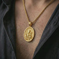 Load image into Gallery viewer, Gold plated Saint Anthony of Padua pendant necklace worn on the chest, premium lifestyle jewelry photo with the Saint Anthony medal centered on a spiga chain.
