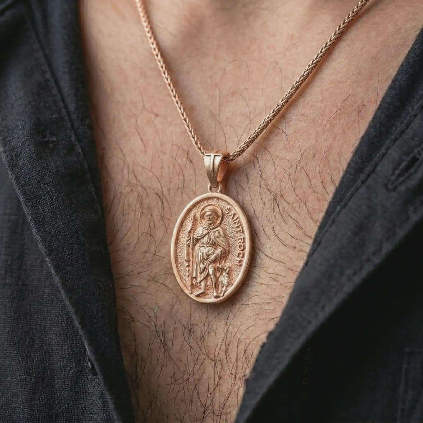 Rose gold plated Saint Roch pendant necklace worn on the chest, close-up lifestyle shot featuring the sacred Saint Roch design with warm rose gold tones.