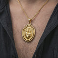 Load image into Gallery viewer, Gold plated Sacred Heart pendant necklace worn on the chest, premium lifestyle jewelry photo with the devotional Sacred Heart medal centered on a spiga chain.
