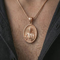 Load image into Gallery viewer, Rose gold plated Saint Francis pendant necklace worn on the chest, close-up lifestyle shot featuring the sacred Saint Francis design with warm rose gold tones.
