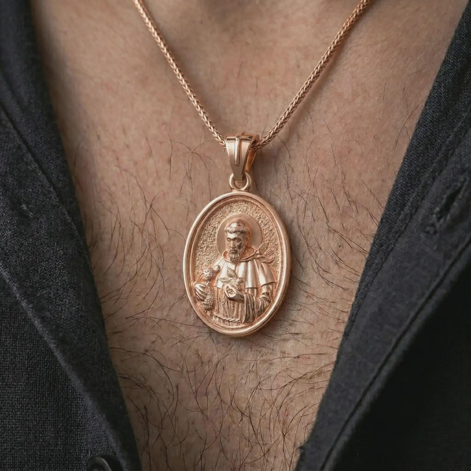 Rose gold plated Saint Francis pendant necklace worn on the chest, close-up lifestyle shot featuring the sacred Saint Francis design with warm rose gold tones.