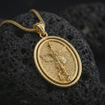 Load image into Gallery viewer, Gold plated Saint Michael spinning pendant necklace on textured volcanic rock, premium close-up studio composition emphasizing the winged archangel, sword, shield, and rotating frame design.
