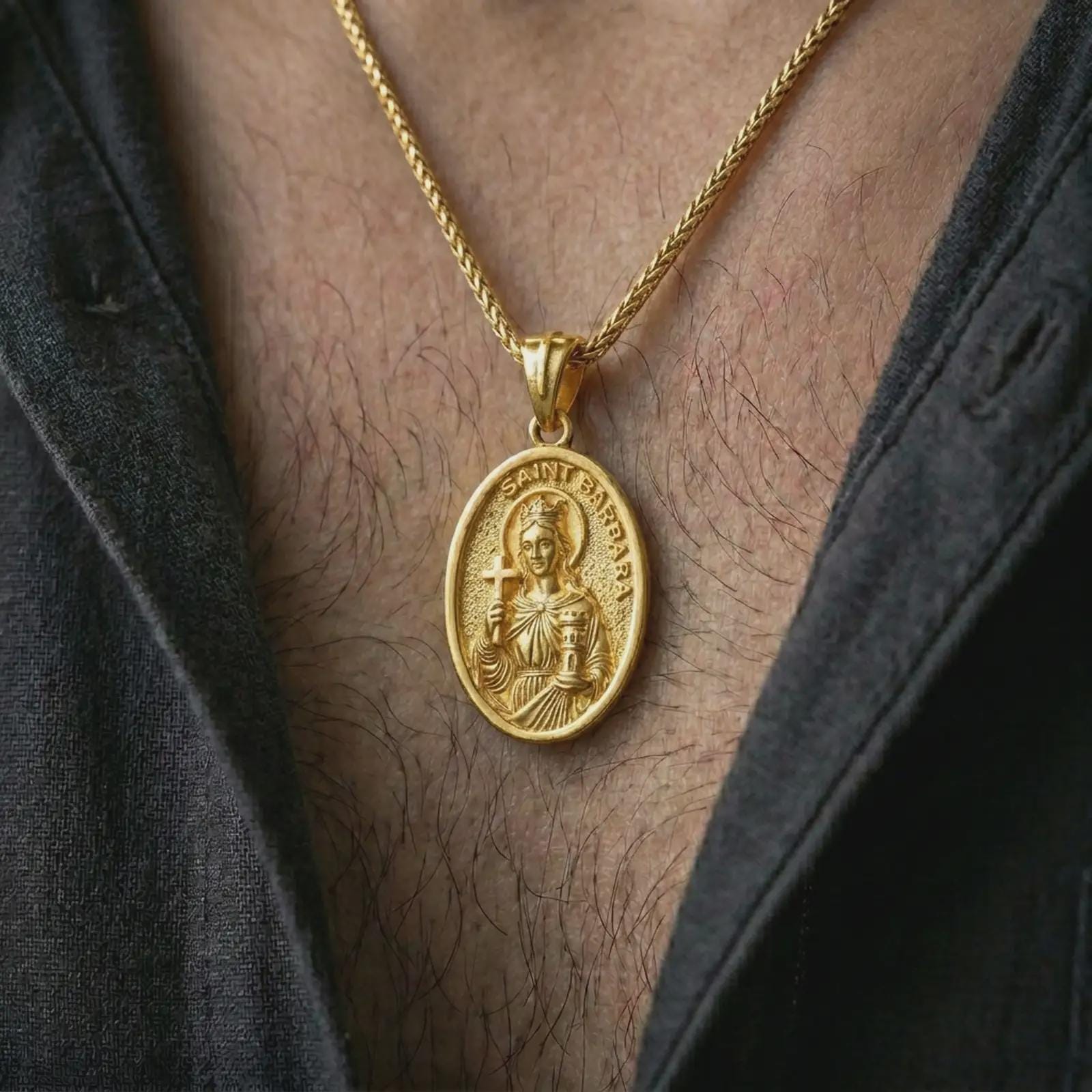 Gold plated Saint Barbara pendant necklace worn on the chest, premium lifestyle jewelry photo with the Saint Barbara medal centered on a spiga chain.