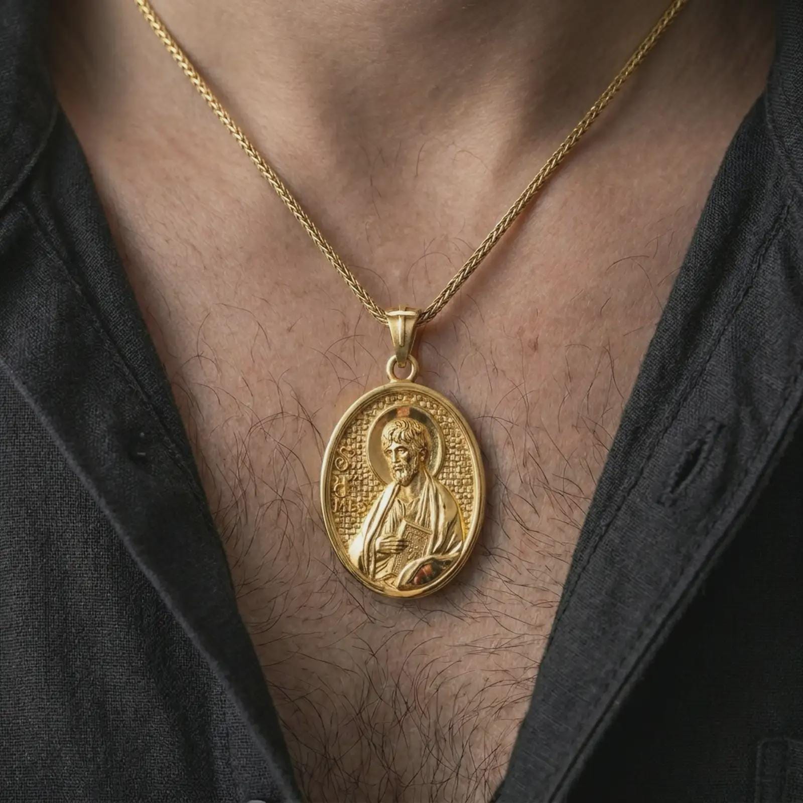 Gold plated Saint James the Apostle pendant necklace worn on the chest, premium lifestyle jewelry photo with the Saint James medal centered on a spiga chain.