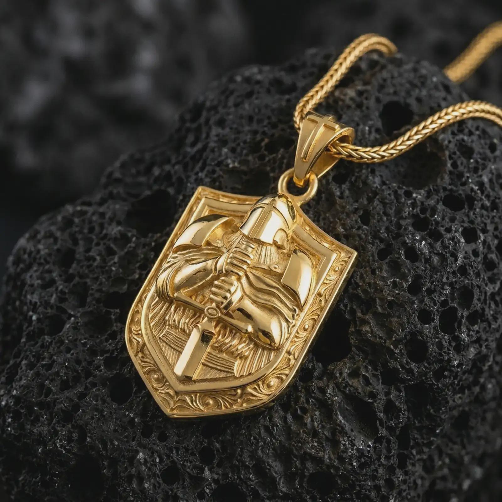 Gold plated knight shield pendant necklace on textured volcanic rock, premium close-up studio composition emphasizing the crusader helmet, sword, and gothic shield design.