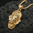 Load image into Gallery viewer, Gold plated Ganesha pendant necklace on textured volcanic rock, premium close-up studio composition emphasizing the elephant god design, crown details, and spiritual talisman symbolism.
