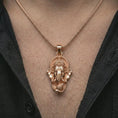 Load image into Gallery viewer, Rose gold plated Ganesha pendant necklace worn on the chest, close-up lifestyle shot featuring the sacred elephant god design with warm rose gold tones.
