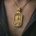 Load image into Gallery viewer, Gold plated Saint Jude dog tag pendant necklace worn on the chest, premium lifestyle jewelry photo with the Saint Jude dog tag medal centered on a spiga chain.
