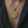 Load image into Gallery viewer, Gold plated Manipura chakra pendant necklace worn on the chest, premium lifestyle jewelry photo with the Manipura mandala pendant centered on a spiga chain.
