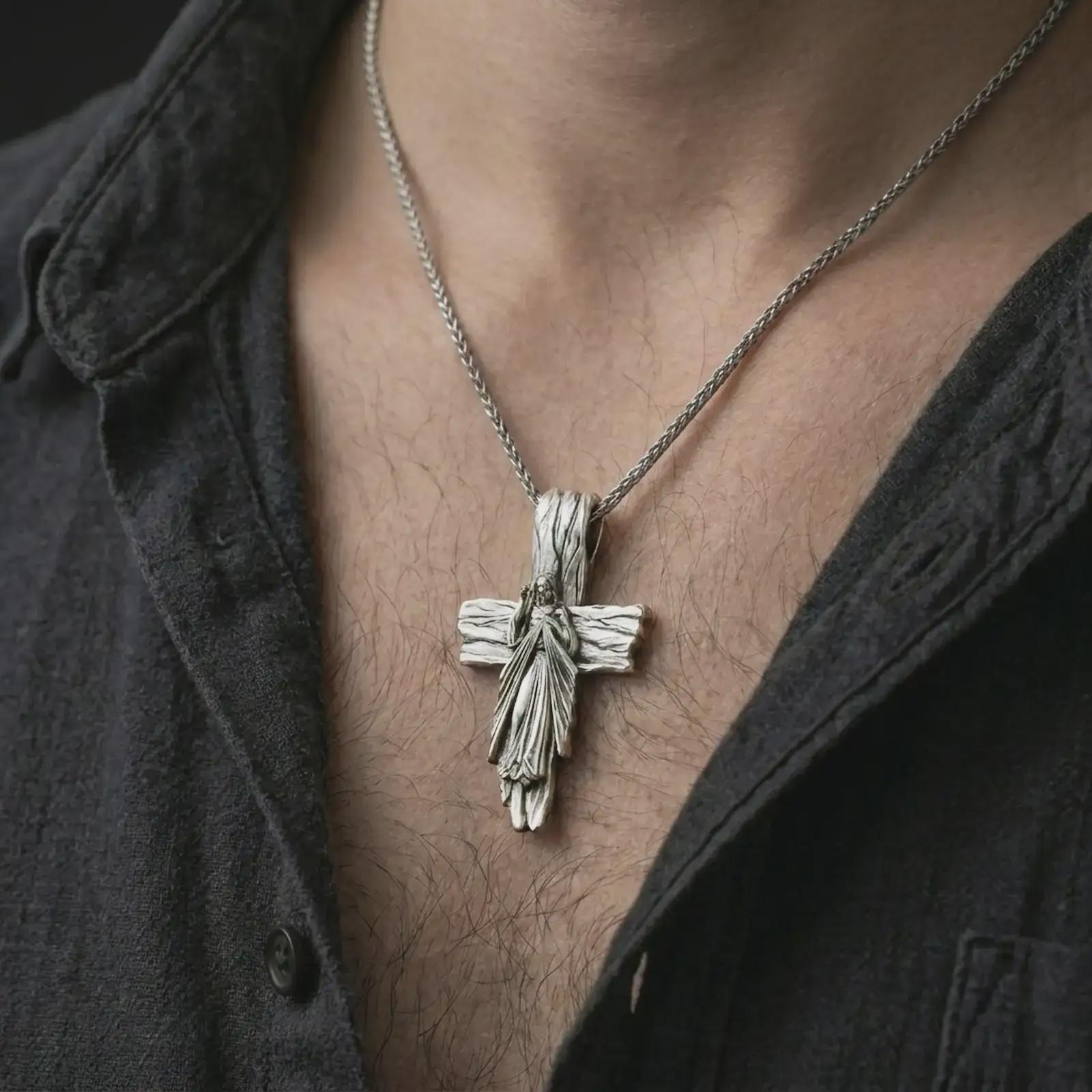 Polished silver Jesus cross pendant necklace worn on the chest, masculine lifestyle shot highlighting the Christ relief, sacred heart rays, and bright silver finish.