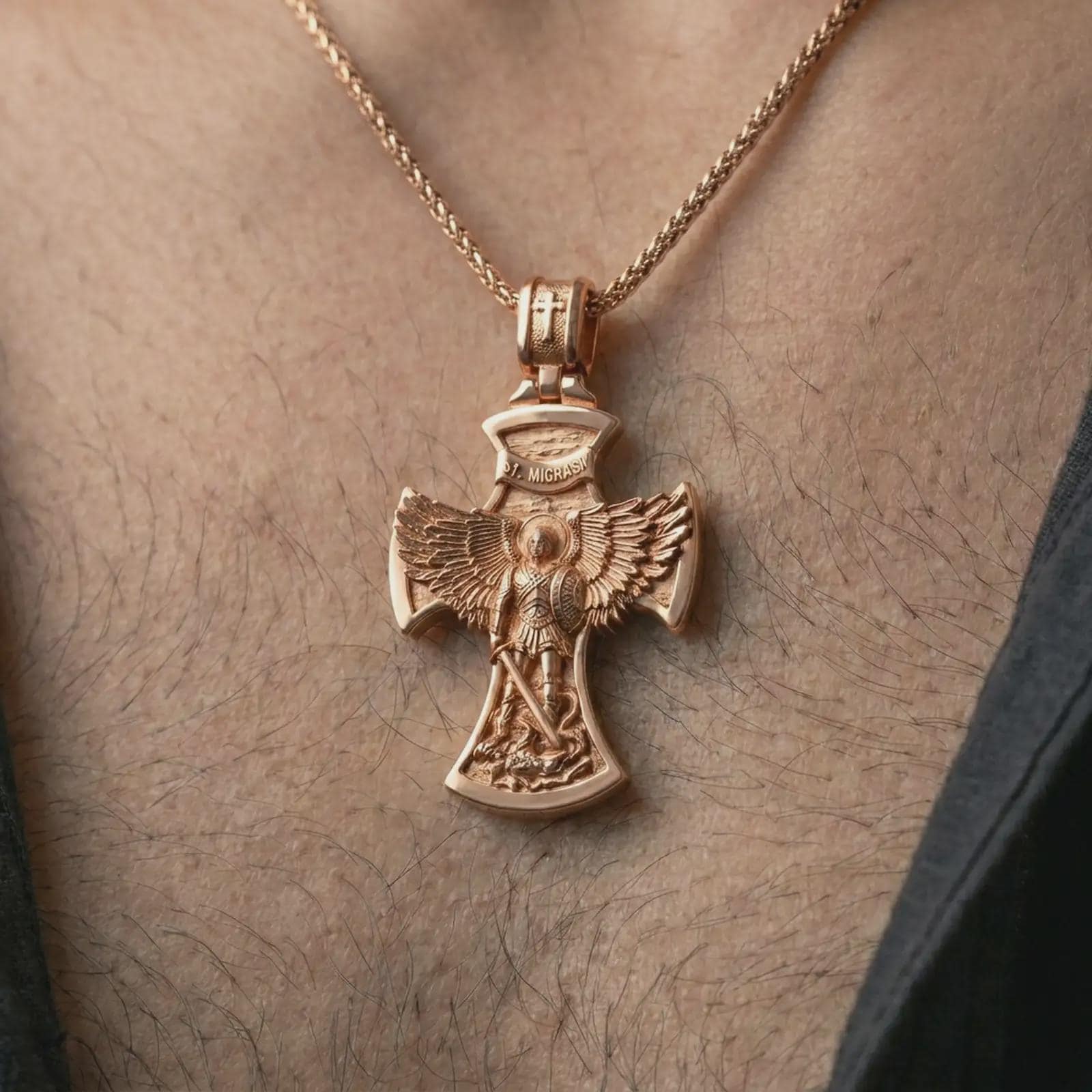 Rose gold plated Saint Michael cross pendant necklace worn on the chest, close-up lifestyle shot featuring the sacred archangel protection design with warm rose gold tones.