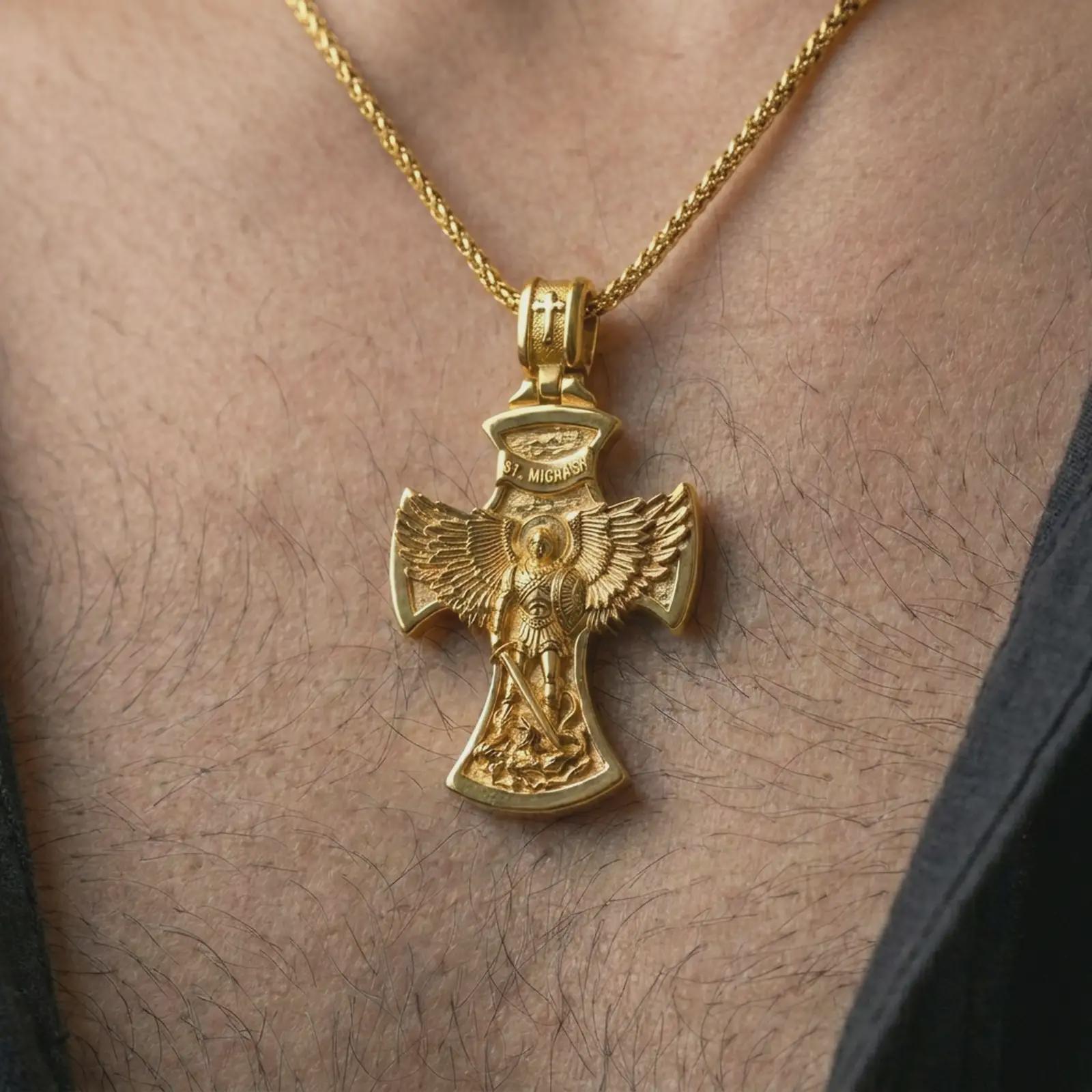 Gold plated Saint Michael cross pendant necklace worn on the chest, premium lifestyle jewelry photo with the Saint Michael cross pendant centered on a spiga chain.