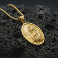 Load image into Gallery viewer, Gold plated Jesus Christ prayer pendant necklace on textured volcanic rock, premium close-up studio composition emphasizing the praying Jesus figure, sunburst rays, and oval medallion design.
