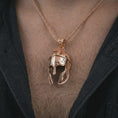 Load image into Gallery viewer, Rose gold plated Spartan helmet pendant necklace worn on the chest, close-up lifestyle shot featuring the bold Spartan helmet design with warm rose gold tones.
