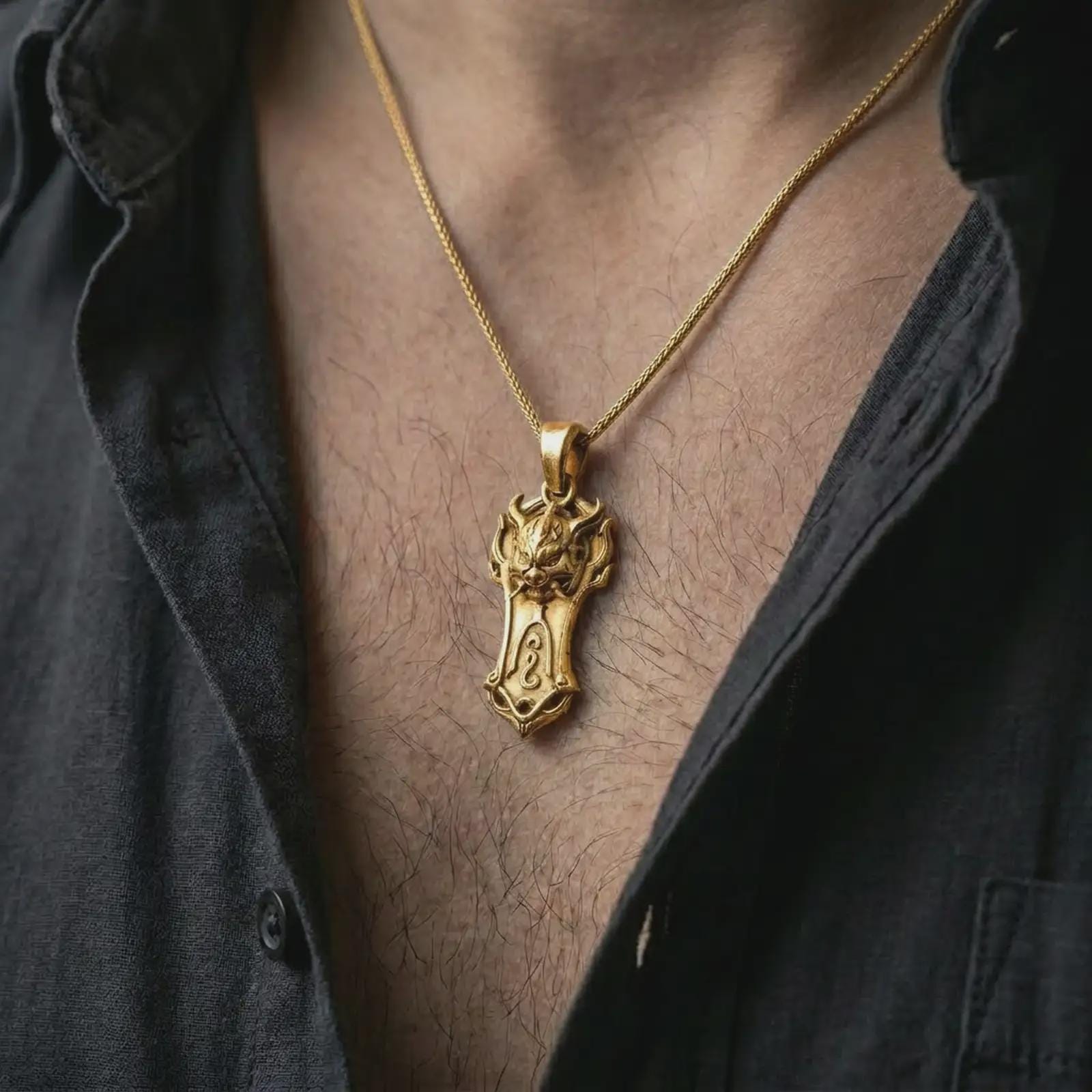A gold plated Taurus bull pendant is worn on the neck in a close-up lifestyle shot, styled as a powerful strength symbol for men.