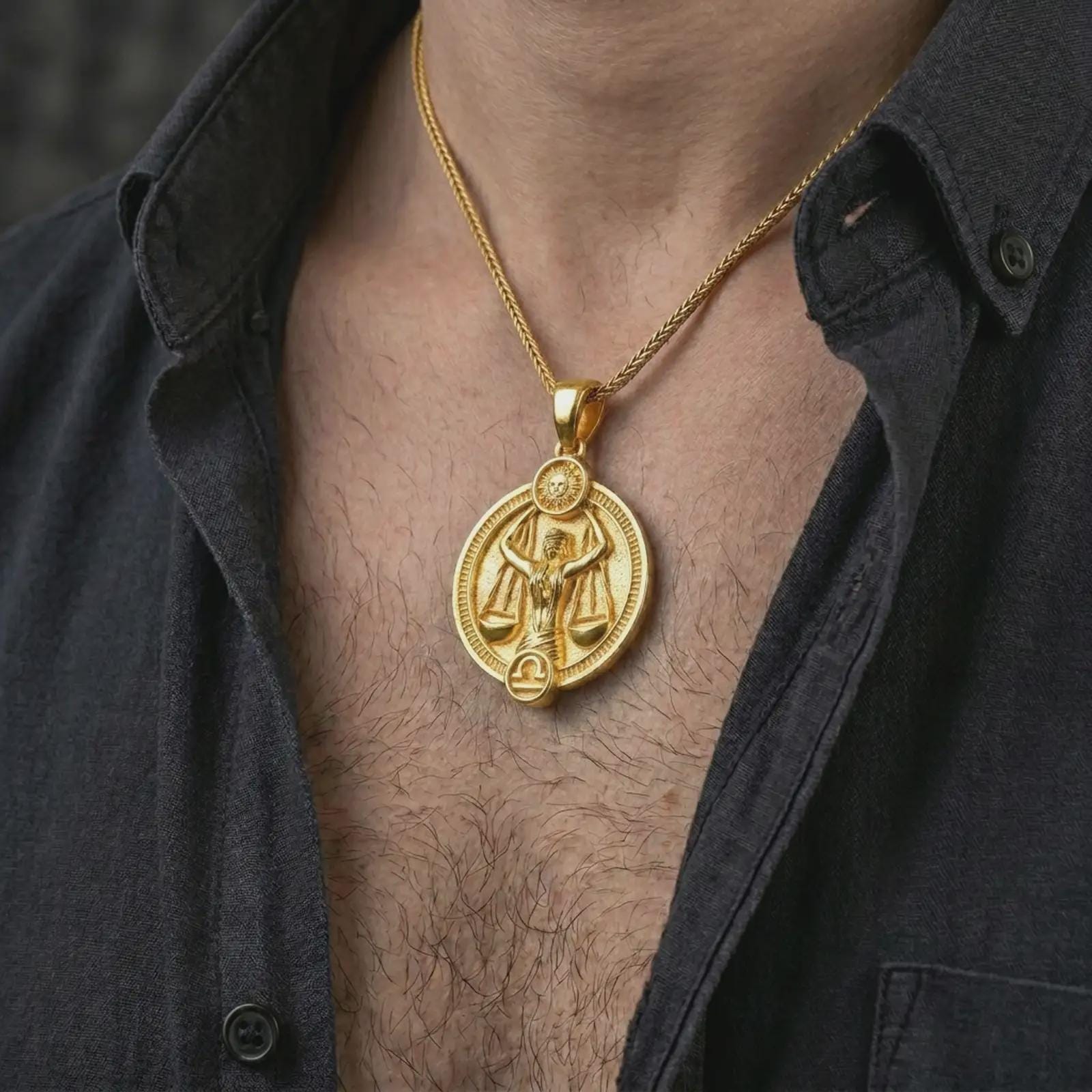 Gold plated Libra zodiac pendant necklace worn on the chest, premium lifestyle jewelry photo with the Libra scales pendant centered on a spiga chain.