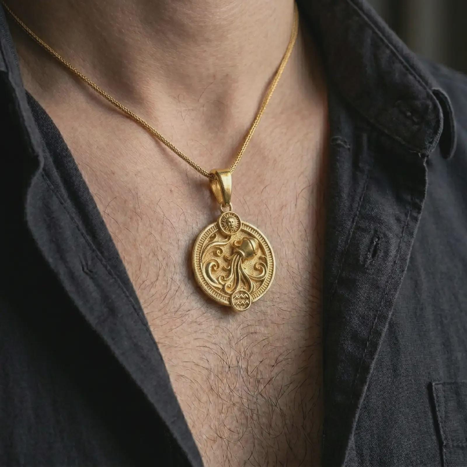 Gold plated Aquarius zodiac pendant necklace worn on the chest, premium lifestyle jewelry photo with the Aquarius water bearer pendant centered on a spiga chain.