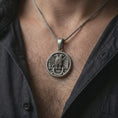 Load image into Gallery viewer, Oxidized Masonic double headed eagle pendant necklace worn on the chest, close-up lifestyle jewelry photo showing the 32nd degree medallion on a spiga chain with dark clothing.
