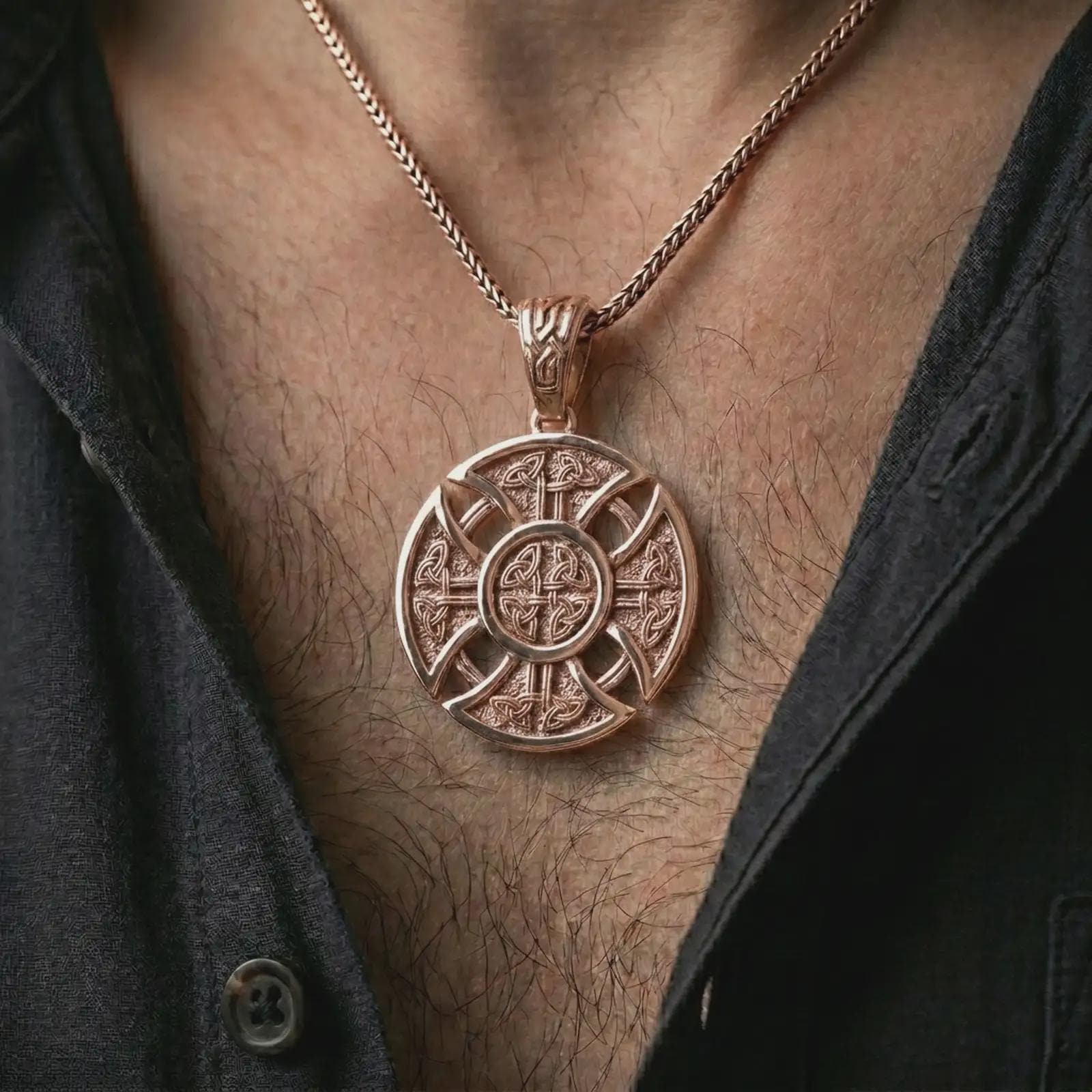 Rose gold plated Celtic cross pendant necklace worn on the chest, close-up lifestyle shot featuring the intricate Norse knotwork cross design with warm rose gold tones.