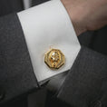 Load image into Gallery viewer, Gold plated gorilla cufflinks worn on a suit cuff, premium formalwear lifestyle photo with the bold gorilla face cufflinks clearly visible.
