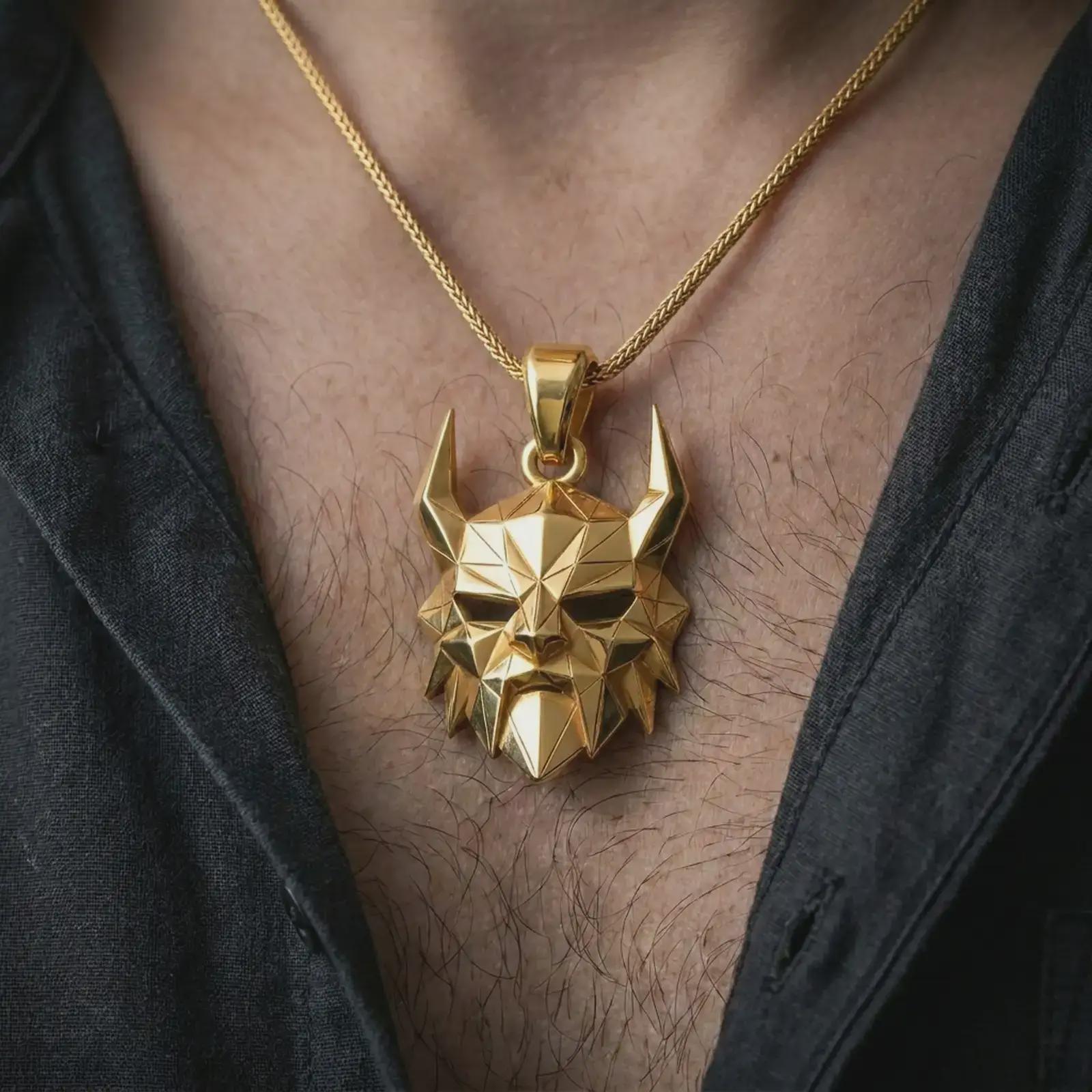 A gold plated Surtur pendant is worn on the neck in a close-up lifestyle shot, styled as a powerful Ragnarok amulet for men.