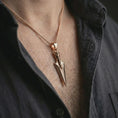 Load image into Gallery viewer, A rose gold plated Gungnir pendant is worn on the neck in a close-up lifestyle composition, highlighting its geometric spear form and symbolic Norse character.
