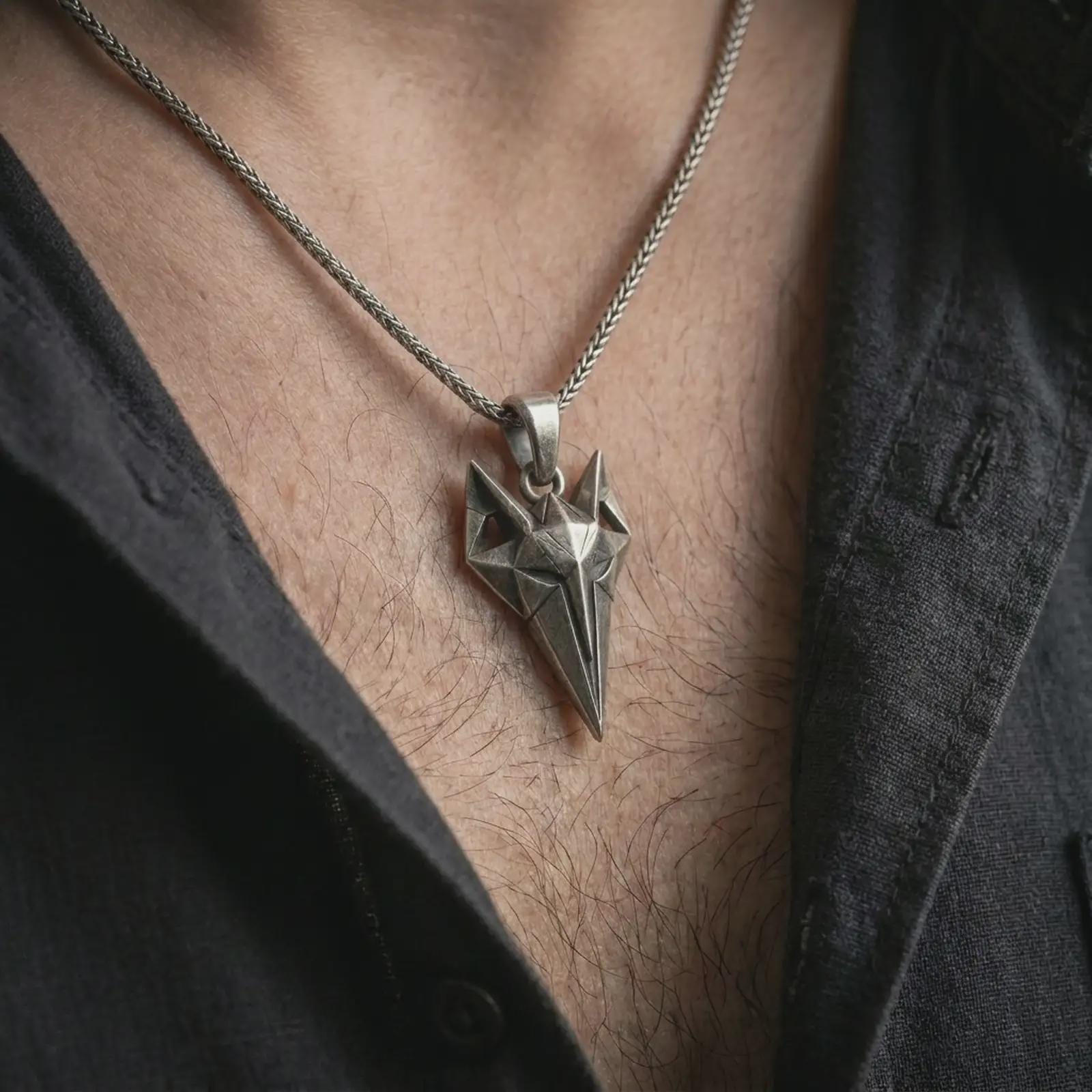An oxidized Freyja cat pendant is worn on the neck in a close-up lifestyle shot, centered on the chest as a meaningful Norse mythology necklace.