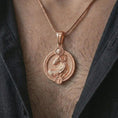 Load image into Gallery viewer, Rose gold plated Aries zodiac pendant necklace worn on the chest, close-up lifestyle shot featuring the bold Aries zodiac design with warm rose gold tones.
