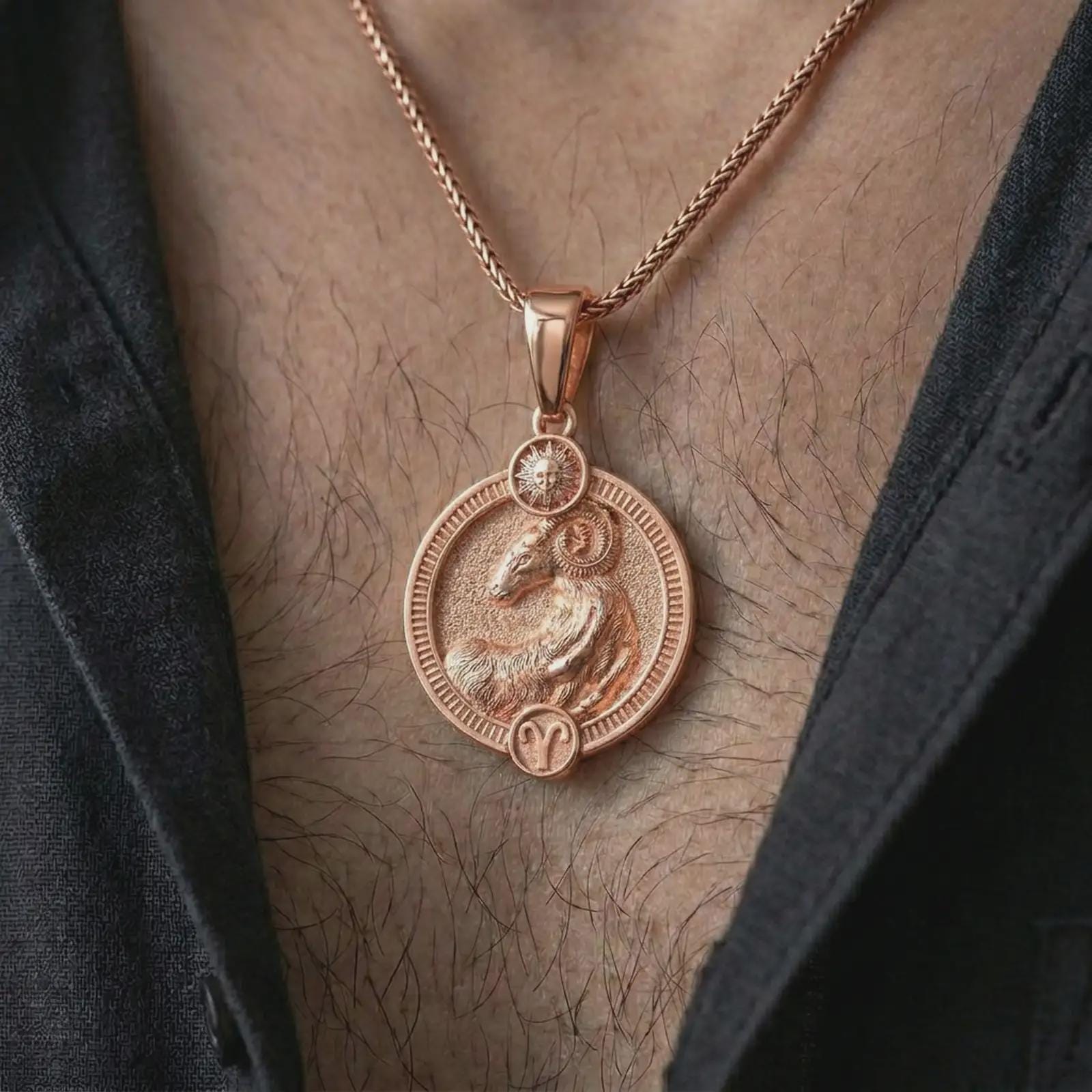 Rose gold plated Aries zodiac pendant necklace worn on the chest, close-up lifestyle shot featuring the bold Aries zodiac design with warm rose gold tones.