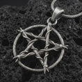 Load image into Gallery viewer, Oxidized thorn pentagram pendant necklace on textured volcanic rock, close-up studio shot highlighting the woven thorn circle, five-point star shape, barbed details, and antique silver contrast.
