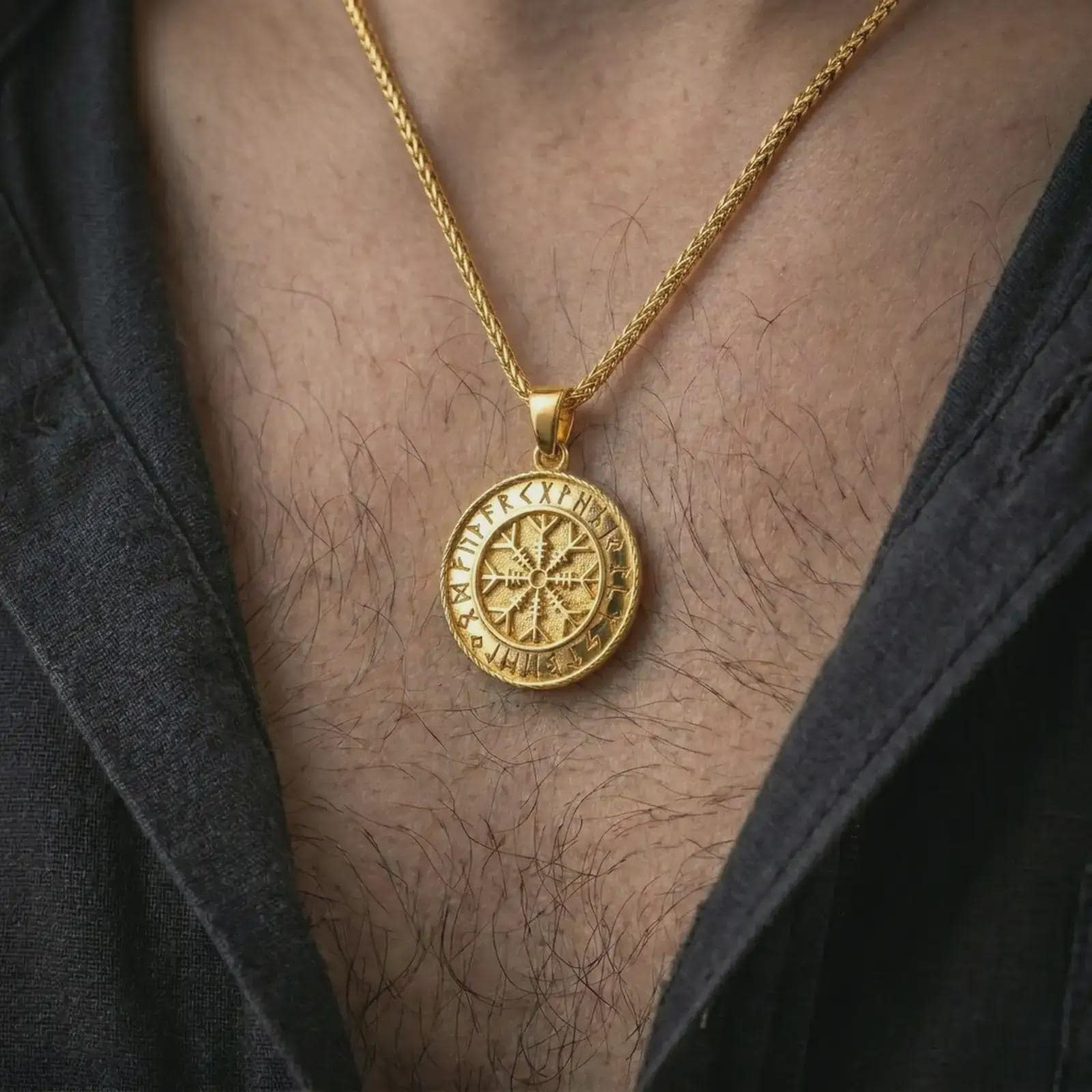 Gold plated Vegvisir Viking rune pendant necklace worn on the chest, premium lifestyle jewelry photo with the Viking protection pendant centered on a spiga chain.