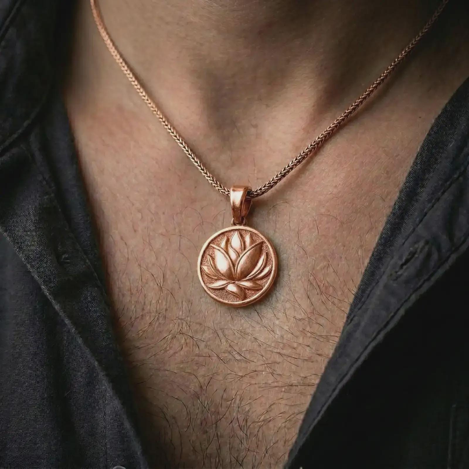 Rose gold plated lotus flower pendant necklace worn on the chest, close-up lifestyle shot featuring the serene lotus flower design with warm rose gold tones.