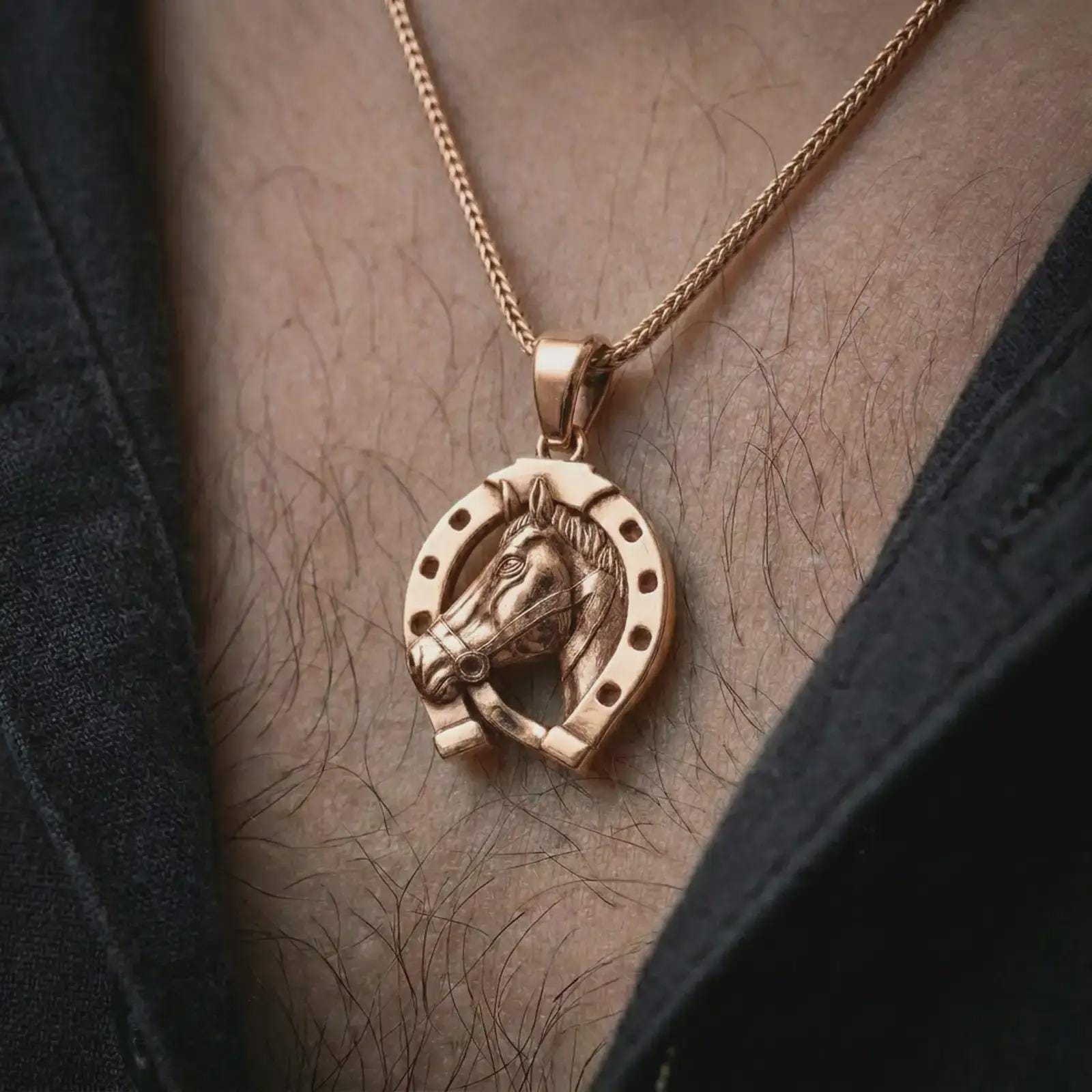 Rose gold plated horseshoe pendant necklace worn on the chest, close-up lifestyle shot featuring the lucky horseshoe design with warm rose gold tones.