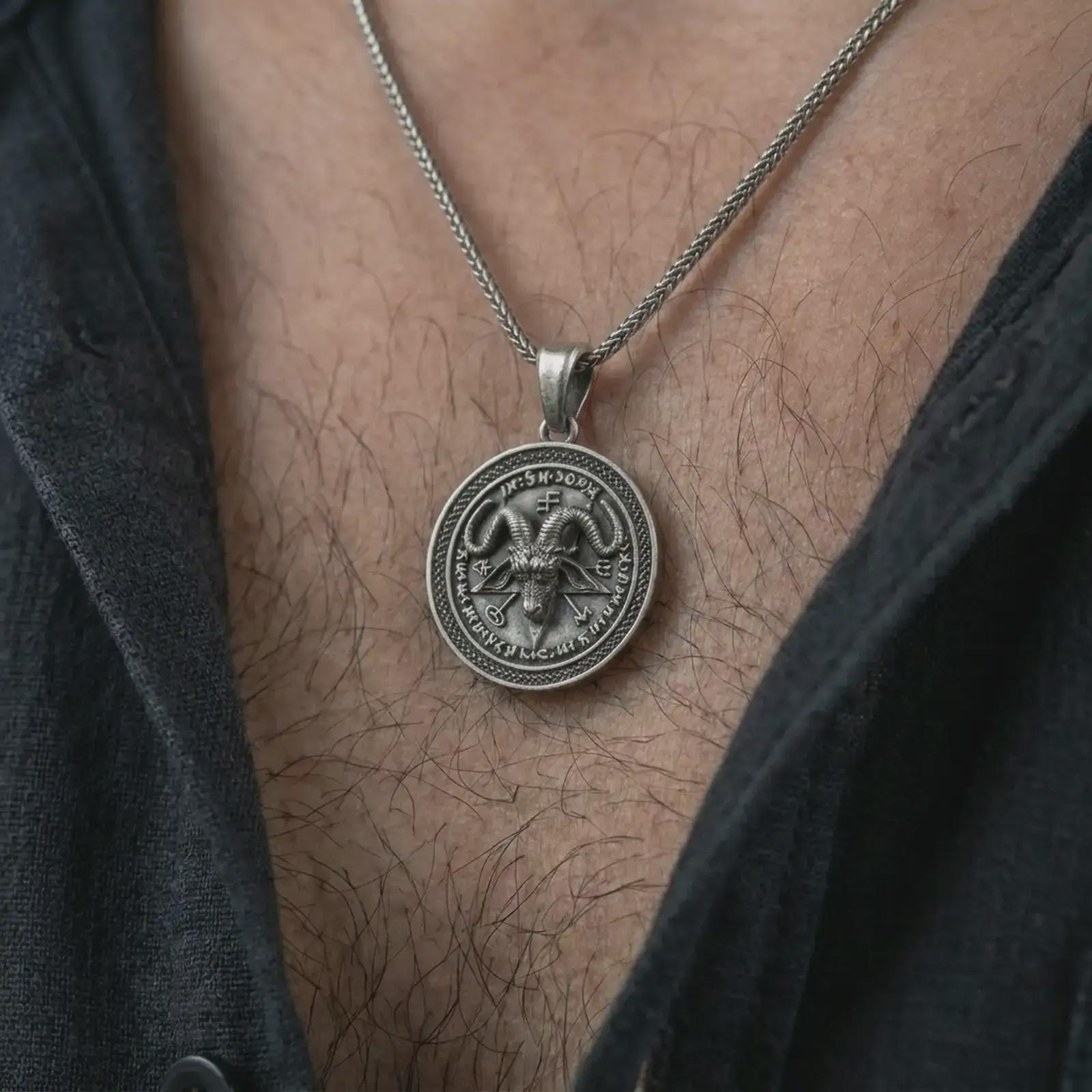 Oxidized Baphomet pendant necklace worn on the chest, close-up lifestyle jewelry photo showing the occult goat medallion on a spiga chain with dark clothing.