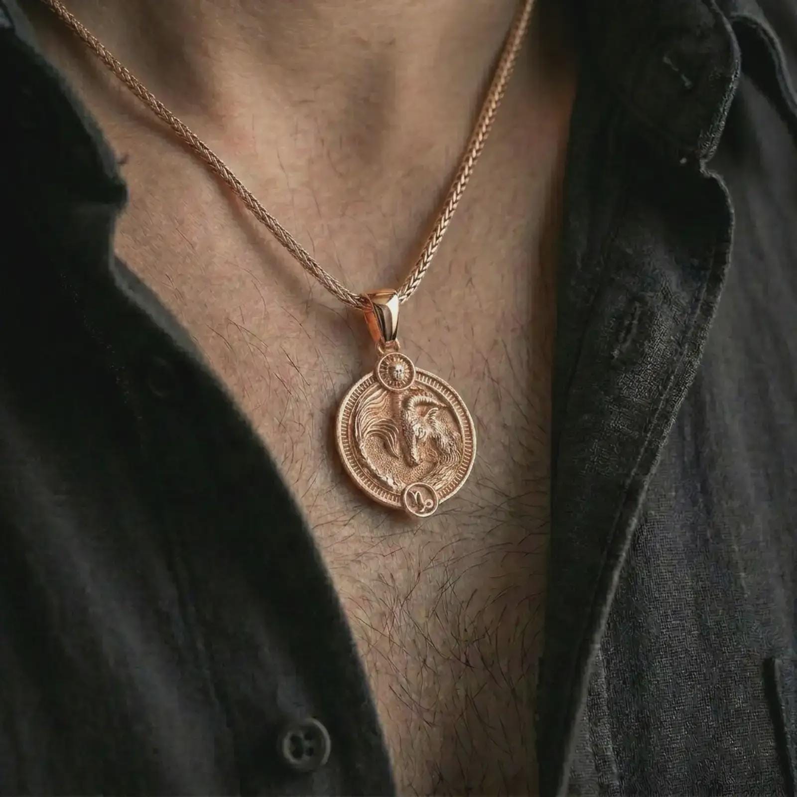 Rose gold plated Capricorn zodiac pendant necklace worn on the chest, close-up lifestyle shot featuring the ambitious Capricorn zodiac design with warm rose gold tones.