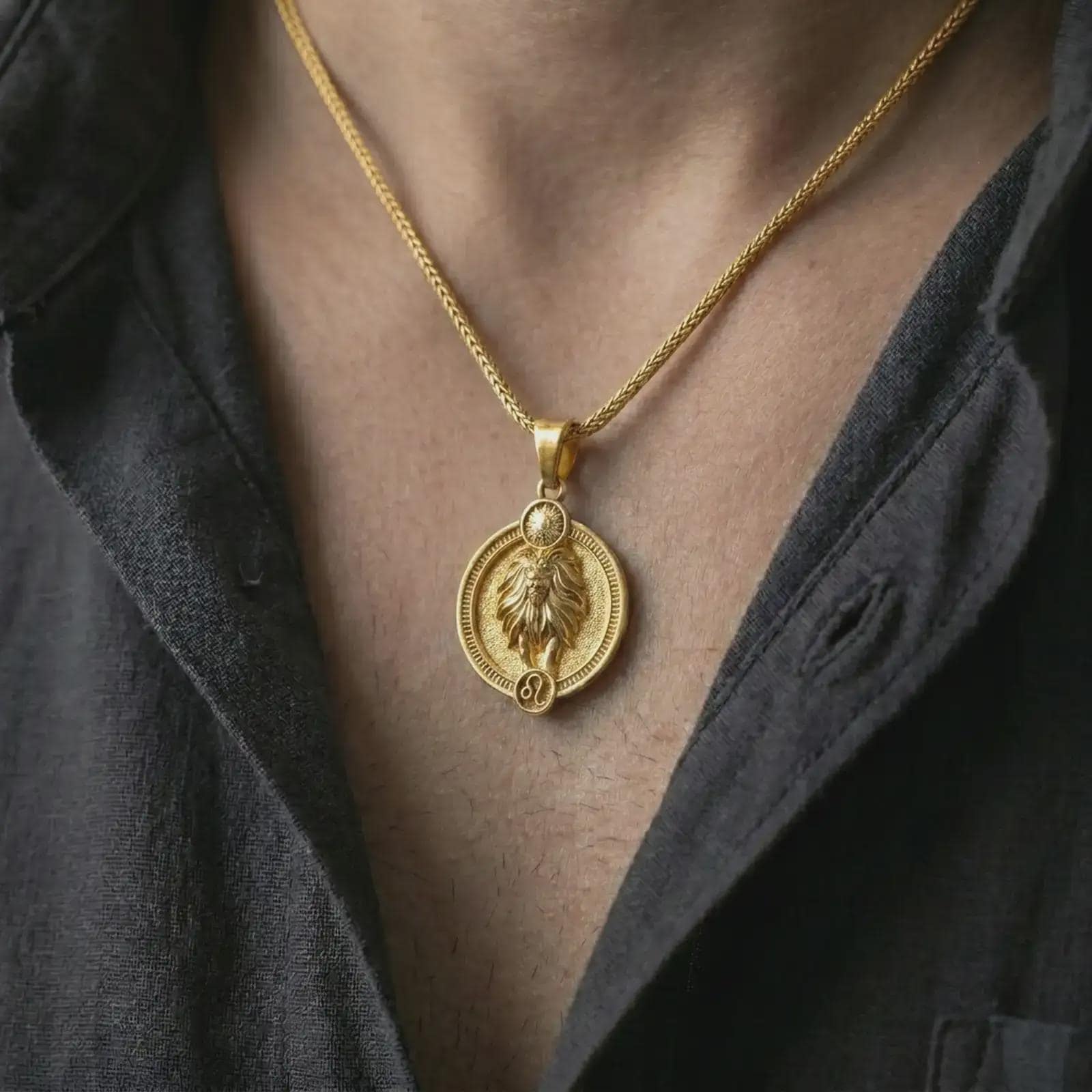 Gold plated Leo zodiac pendant necklace worn on the chest, premium lifestyle jewelry photo with the Leo lion pendant centered on a spiga chain.