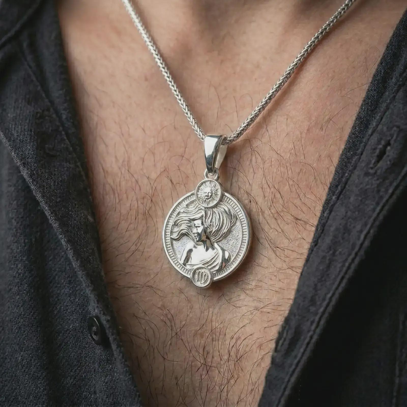 Polished silver Virgo zodiac pendant necklace worn on the chest, feminine lifestyle shot highlighting the flowing hair relief, sun detail, and bright silver finish.