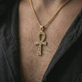 Load image into Gallery viewer, Gold plated ankh cross pendant necklace worn on the chest, premium lifestyle jewelry photo with the Egyptian ankh pendant centered on a spiga chain.
