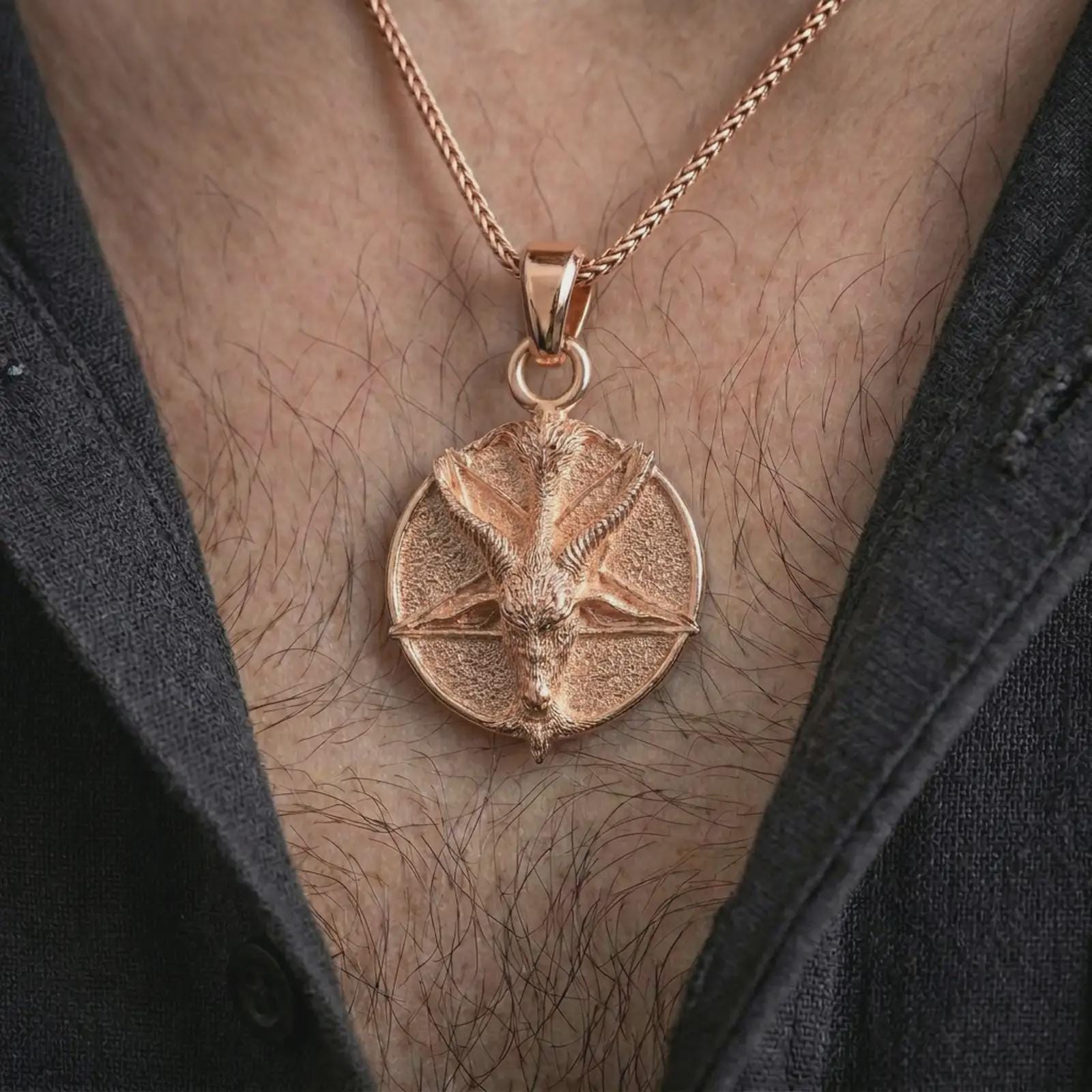 Rose gold plated goat pentagram pendant necklace worn on the chest, close-up lifestyle shot featuring the dark goat pentagram design with warm rose gold tones.