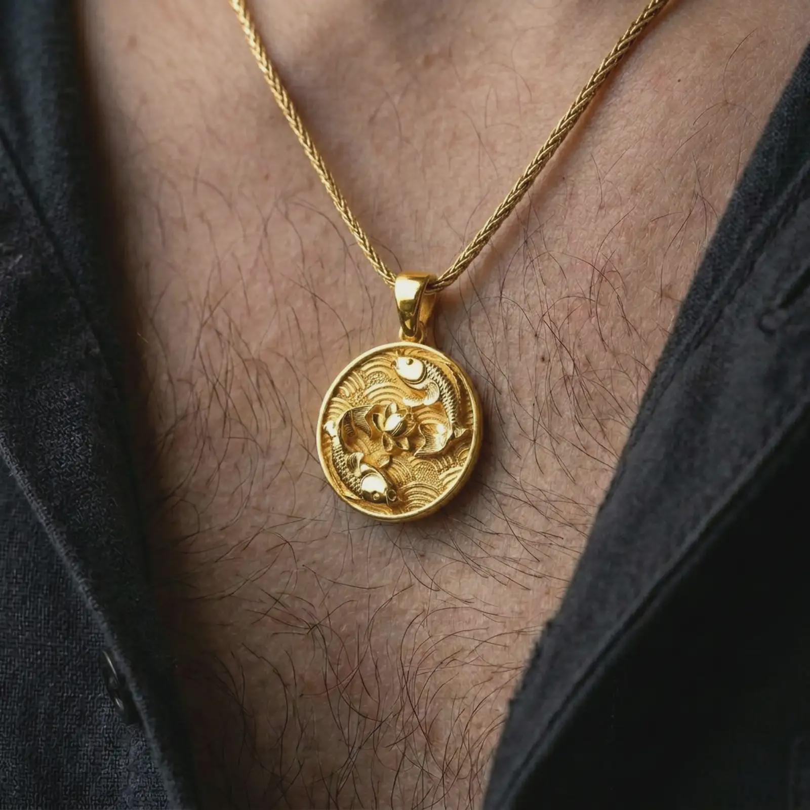 Gold plated koi fish lotus pendant necklace worn on the chest, premium lifestyle jewelry photo with the koi fish lotus pendant centered on a spiga chain.