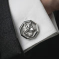Load image into Gallery viewer, A polished silver wolf head cufflink is worn on a shirt cuff in a premium close-up lifestyle image, showing the detailed wolf profile clearly.
