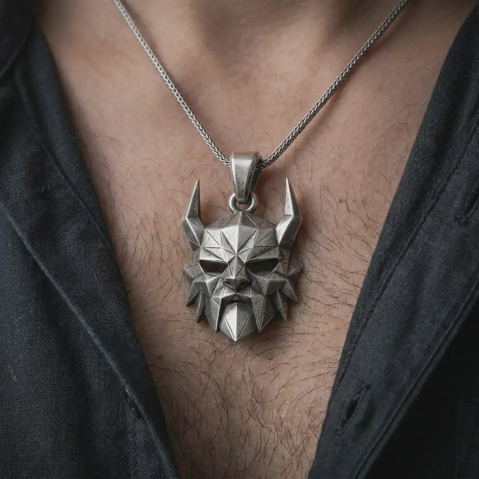An oxidized Surtur pendant is worn on the neck in a close-up lifestyle shot, centered on the chest as a bold Norse mythology statement piece.