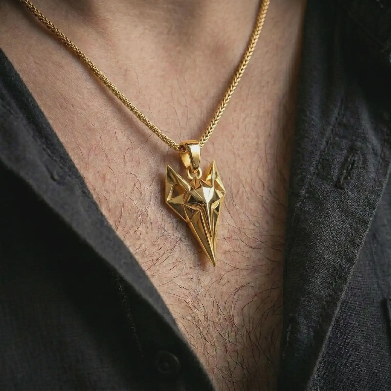 A gold plated Freyja cat pendant is worn on the neck in a close-up lifestyle shot, styled as a distinctive Viking goddess gift for mythology lovers.