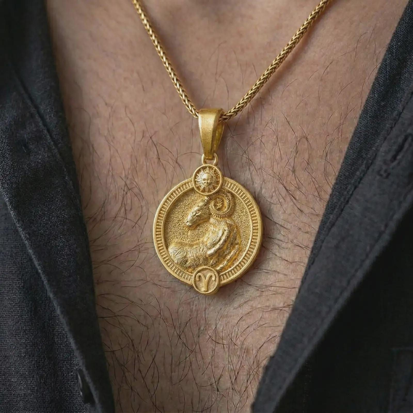 Gold plated Aries zodiac pendant necklace worn on the chest, premium lifestyle jewelry photo with the Aries ram pendant centered on a spiga chain.